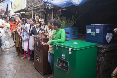 Wet and dry waste group's presentation on the main street in Mariamma Nagar